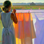 A Duluth MN artist captures a scene where a woman stands at a clothesline, holding a clothespin. She wears a light dress and headscarf as sunlight casts vibrant colors on the hanging sheets, with a serene landscape and house visible in the background.