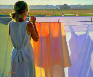 A Duluth MN artist captures a scene where a woman stands at a clothesline, holding a clothespin. She wears a light dress and headscarf as sunlight casts vibrant colors on the hanging sheets, with a serene landscape and house visible in the background.