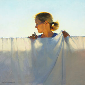 A woman, reminiscent of a Duluth MN artist, hangs a white sheet on a clothesline with her hair tied back. The sun casts a warm glow, creating a serene and peaceful atmosphere. She holds a clothespin, gazing downward against the clear sky.