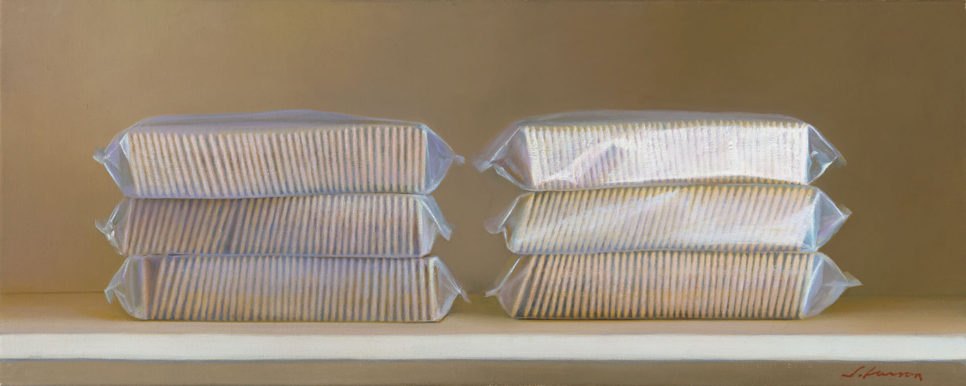 Six stacks of packaged golden crackers, reminiscent of a Duluth MN artist's palette, are neatly arranged in rows of three on a shelf, set against a plain neutral background. The packaging is slightly glossy, reflecting light softly.