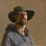A portrait by a Duluth MN artist features a man in a wide-brimmed hat and gray hoodie. The muted brown background accentuates his thoughtful expression and rugged appearance. The painting's realistic style captures every detailed texture beautifully.