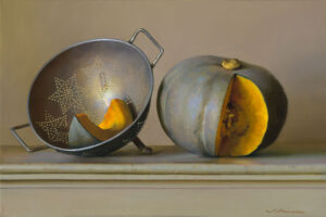 A painting by a Duluth MN artist features a sliced pumpkin, with one piece resting inside a star-patterned colander and the remainder beside it on a light-colored surface. The image exudes a warm, natural tone.