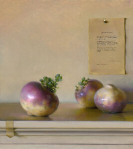 Three turnips with lush green leaves rest on a light surface, while a sheet of paper with printed text is pinned to the beige wall behind them. Soft lighting highlights the Duluth MN artist's portrayal of the turnips' rich purple and white hues.