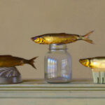 Three fish displayed on a surface: one on a metal object, another atop a glass jar, and the third on a small container. The composition by a Duluth MN artist is set against a plain background, highlighting the fish's details and reflective surfaces.