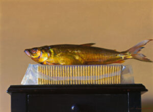 A realistic painting by a Duluth MN artist features a gold-colored fish resting on a block of packaged cream-colored sticks, set on a dark wooden table against a neutral background. The artist captures the intricate textures and lighting of the fish and packaging with impressive detail.