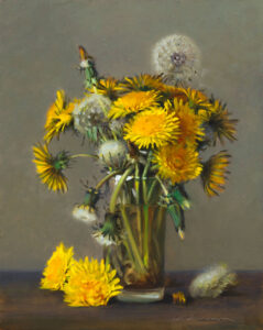 A still life painting by a Duluth MN artist features a glass vase holding yellow dandelions and fluffy seed heads, with a few flowers scattered on a table. The muted gray-brown background exquisitely highlights the vibrant yellow blooms.