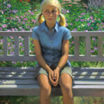 A painting by a Duluth MN artist captures a young girl with blonde pigtails sitting on a bench. She wears a light blue shirt and green shorts, surrounded by lush greenery and blooming pink flowers.