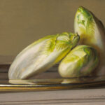 A still life by a Duluth MN artist features three heads of Belgian endive on a silver plate, set against a muted brown background. The green and white leaves exude a soft, natural sheen.