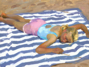 A Duluth MN artist captures a young girl in a pastel swimsuit lying face down on a striped beach towel. Her blonde hair glistens as she sunbathes on the sandy beach, surrounded by warm tones and soft brushstrokes that evoke serenity.