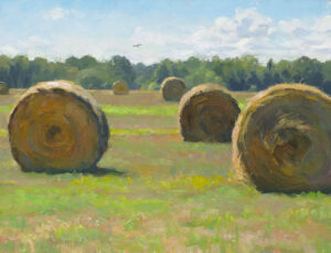 A scenic landscape painted by a talented Duluth MN artist captures a wide, grassy field dotted with large, round hay bales. The sky is bright blue with fluffy white clouds, and a line of trees graces the horizon.
