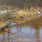 A serene winter landscape painted by a Duluth MN artist features a partially frozen river reflecting the bare trees and cloudy sky. Yellow-brown grasses and snow patches line the riverbank, creating a quiet, tranquil atmosphere.