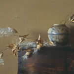 A still life painting by a Duluth MN artist features a ceramic vase with botanical motifs on a wooden surface. Dried leaves and delicate white flowers surround the vase, set against a muted brown background.