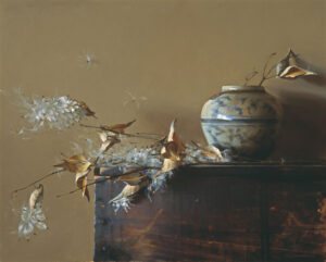 A still life painting by a Duluth MN artist features a ceramic vase with botanical motifs on a wooden surface. Dried leaves and delicate white flowers surround the vase, set against a muted brown background.