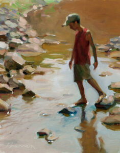 A painting by a Duluth MN artist captures a person in a red shirt and cap walking barefoot on rocks across a shallow stream. The background features earth tones and blurred details, creating a peaceful, natural setting.