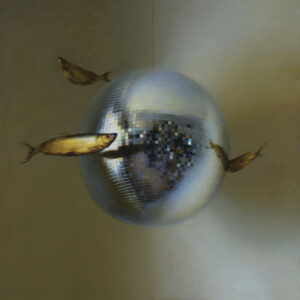 A surreal image of a shiny disco ball with four fish swimming around it against a muted background. The mirrored surface reflects light, creating an ethereal atmosphere.