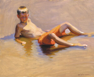 A painting by a talented Duluth MN artist captures a boy lounging in shallow water. Shirtless and wearing orange shorts, he leans back on his hands, casting a shadow on the sand. The water reflects vivid patches of light and color.