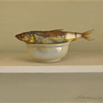 A realistic painting by a Duluth MN artist depicts a fish resting in a small white bowl against a neutral background. The scene is minimalistic, with the fish's metallic scales adding a touch of color and texture.