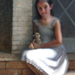 A young girl with long dark hair sits on a brick step, wearing a light, sleeveless dress. She holds a stuffed toy in her lap and smiles gently. The scene captures the charm reminiscent of a Duluth MN artist's style, framed by a brick wall and a window with a triangular design.