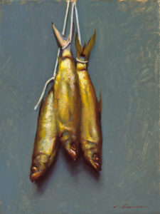 A realistic painting by a Duluth MN artist features three fish hanging vertically by their tails on strings against a grayish-blue background. The golden fish appear freshly caught, with exquisitely detailed scales and fins, capturing the essence of an artisanal catch.