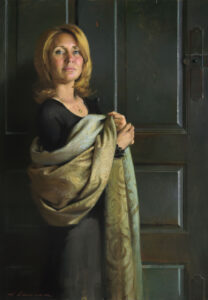 A woman with shoulder-length hair stands in front of a dark green door, holding an ornate, patterned fabric. She wears a black top and looks forward with a calm expression. Created by a Duluth MN artist, the painting embodies a classical and realistic style.