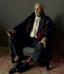 An elderly man, resembling a Duluth MN artist in his refined taste, sits in an armchair holding a glass. He's dressed in a formal suit and tie with a dark coat and red scarf, while his checkered socks add flair. The sophisticated ambiance is complemented by the muted background.