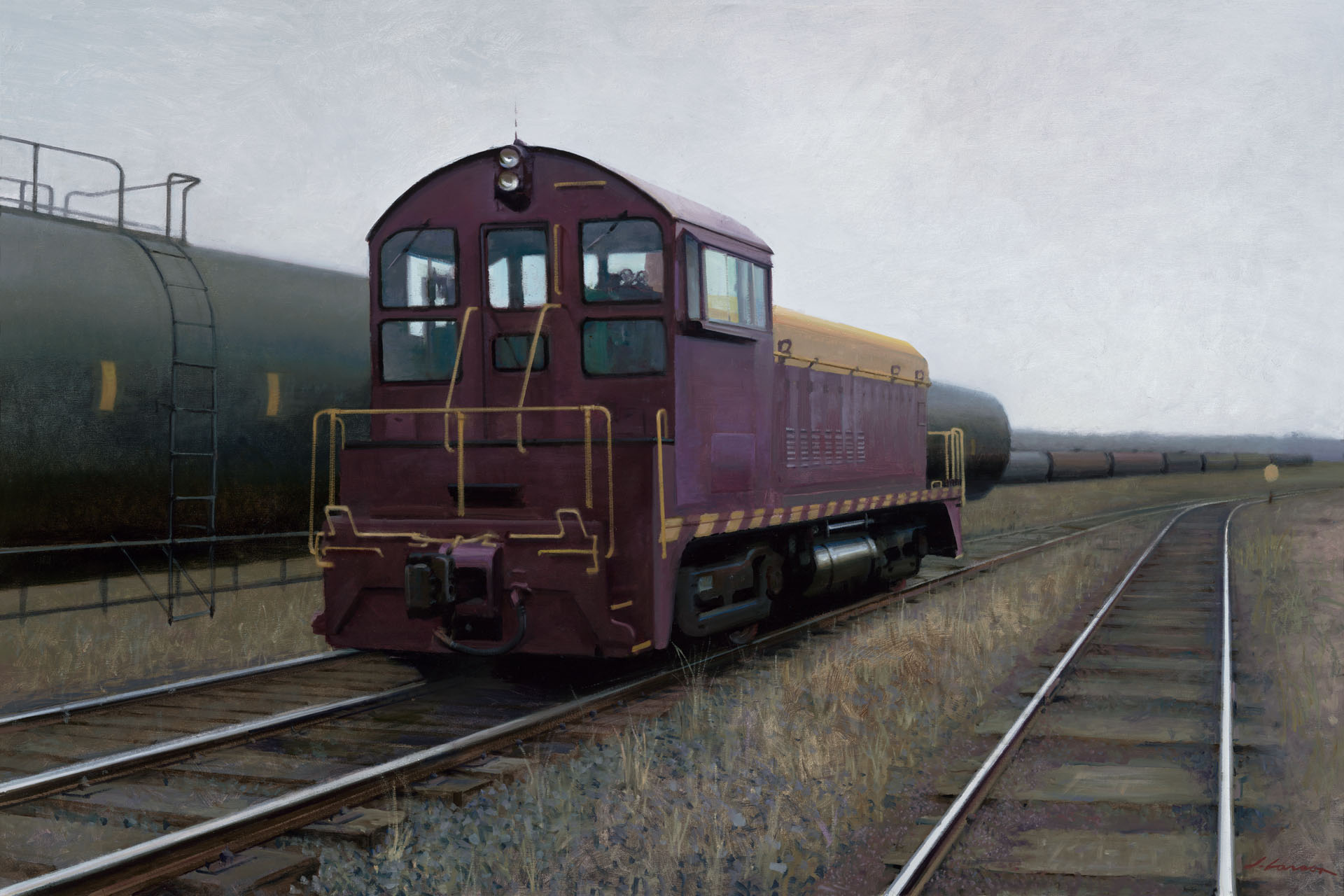 A maroon locomotive, resembling an evocative scene from a Duluth MN artist's canvas, travels along railway tracks next to a line of black tank cars. The sky is overcast, and the landscape is flat, with dry grass bordering the tracks.